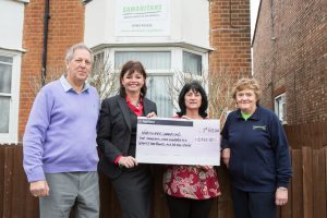 MD Claire Austin hands over cheque for £5,972.15 to North Herts Samaritans